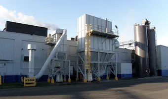Exterior dust-collection equipment at an industrial manufacturing facility