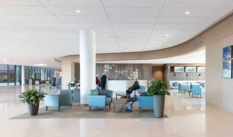 Trinity Health lobby with lounge seating and a curved reception desk