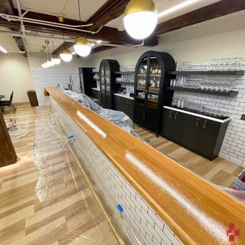 Bar with newly installed commercial wallcovering done by D4 in Muskegon, MI