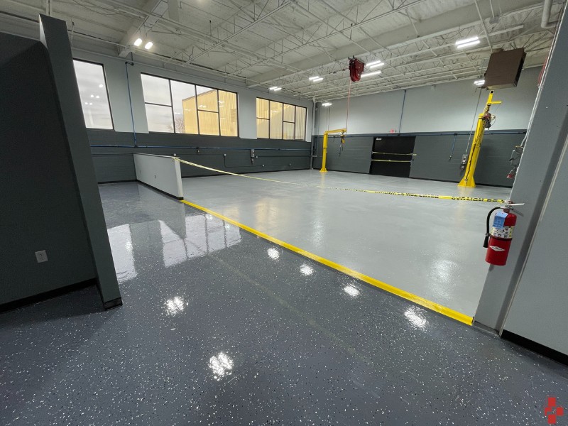 Freshly coated facility flooring (dark gray) by D4 in Muskegon, MI