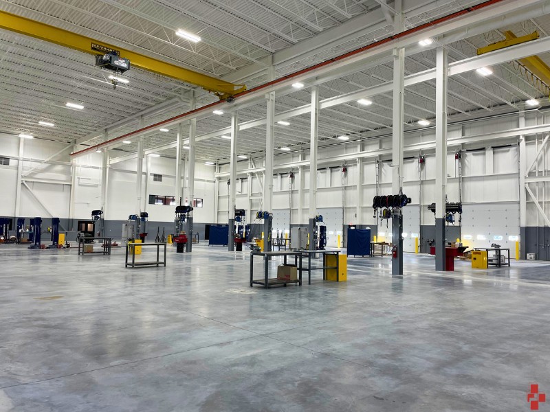 Warehouse machinery freshly painted white and gray in Muskegon MI