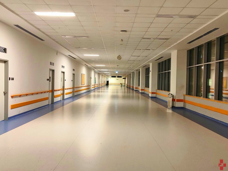 Hospital in Muskegon, MI, newly painted with light brown and yellow accent