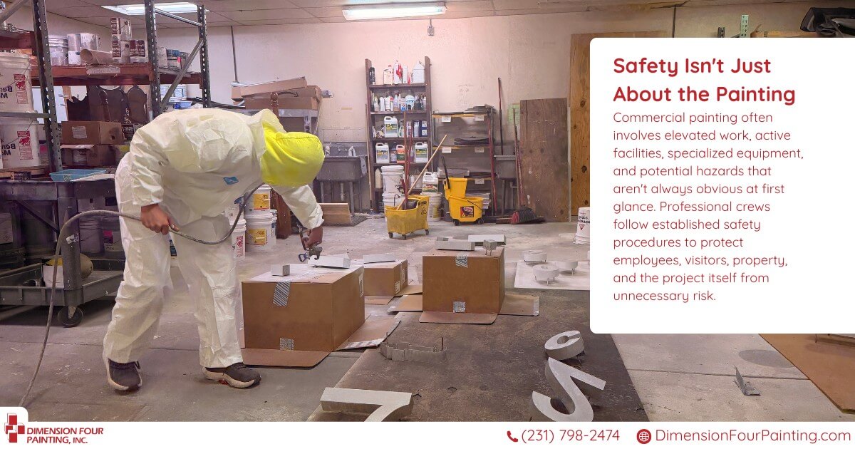 Man painting signage objects with full protective gear on